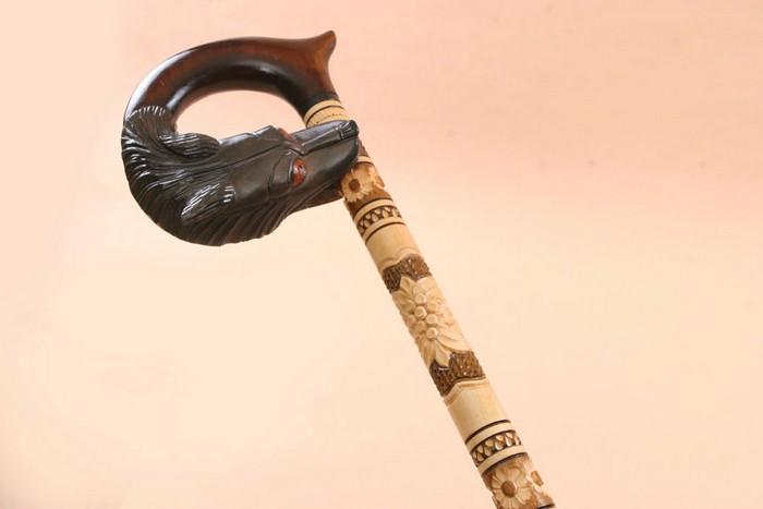 Carved Walking Stick - Gripping Wolf
